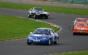 Paul Rigg in the blue MGF number 77 on his way to a Class win in the first MG Cockshoot race of the day